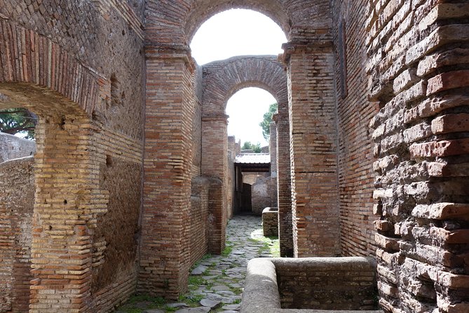 Ancient Ostia Antica Semi-Private Day Trip from Rome by Train with Guide - Sitting In The Ancient Amphitheater