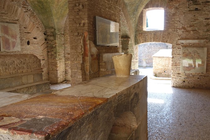 Ancient Ostia Antica Semi-Private Day Trip from Rome by Train with Guide - Shops, Homes, Taverns, And The Forum Of The Corporations
