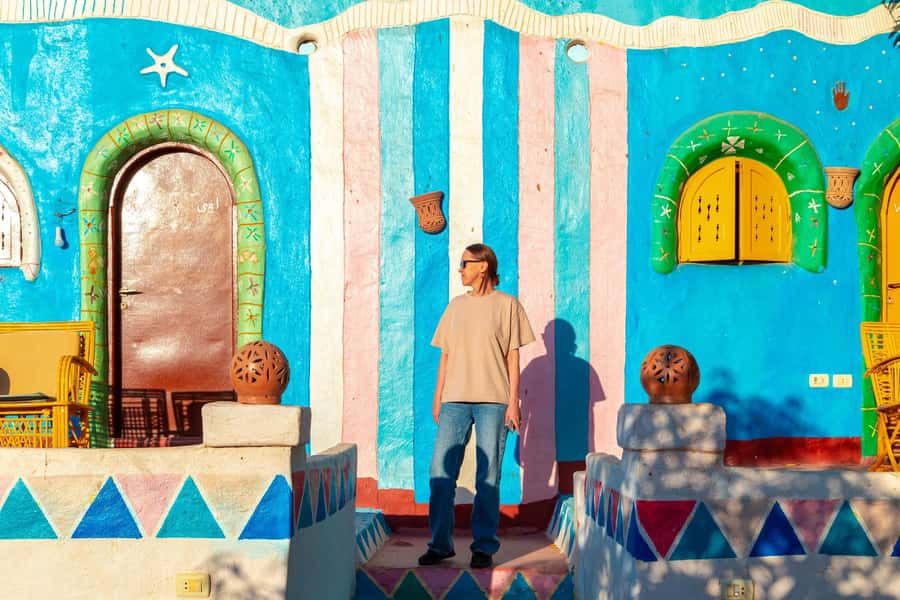 Aswan: Nubian Village Day Trip with Camel Ride - Riding a camel through the colorful streets