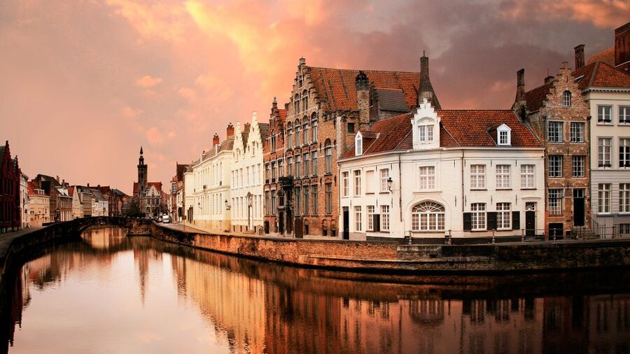 From Amsterdam: Bruges Day Trip in English with Boat Option - What the Guide Adds