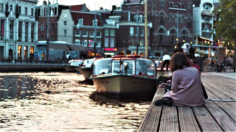From Brussels: Cheese, Clogs & Windmills Amsterdam Day Trip - A short canal cruise from the city center