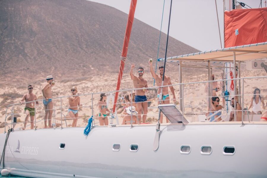 From Lanzarote: Sailing Day Trip Around La Graciosa - Boarding the catamaran with cava and snacks