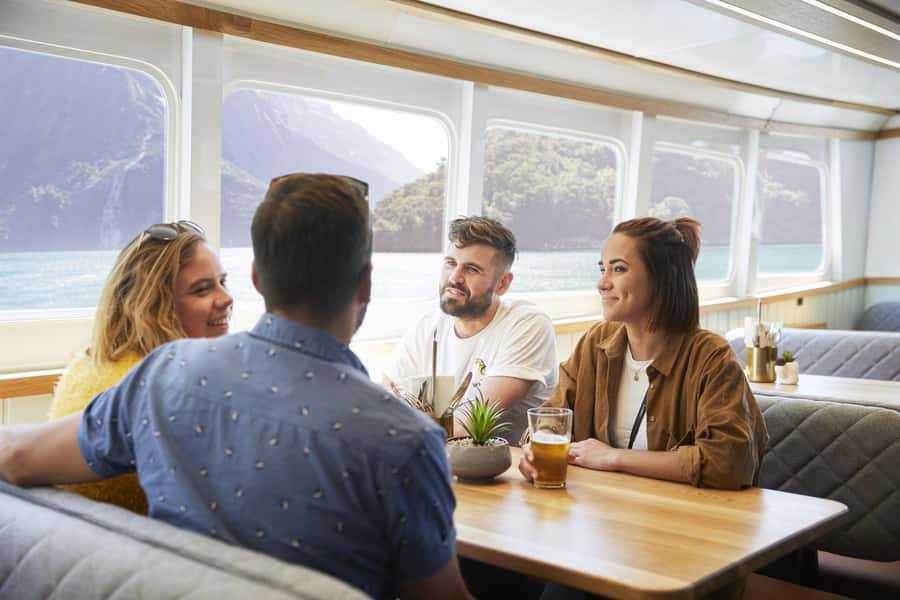 From Queenstown: Milford Sound Cruise and Coach Day Trip - Boarding the Milford Sound cruise