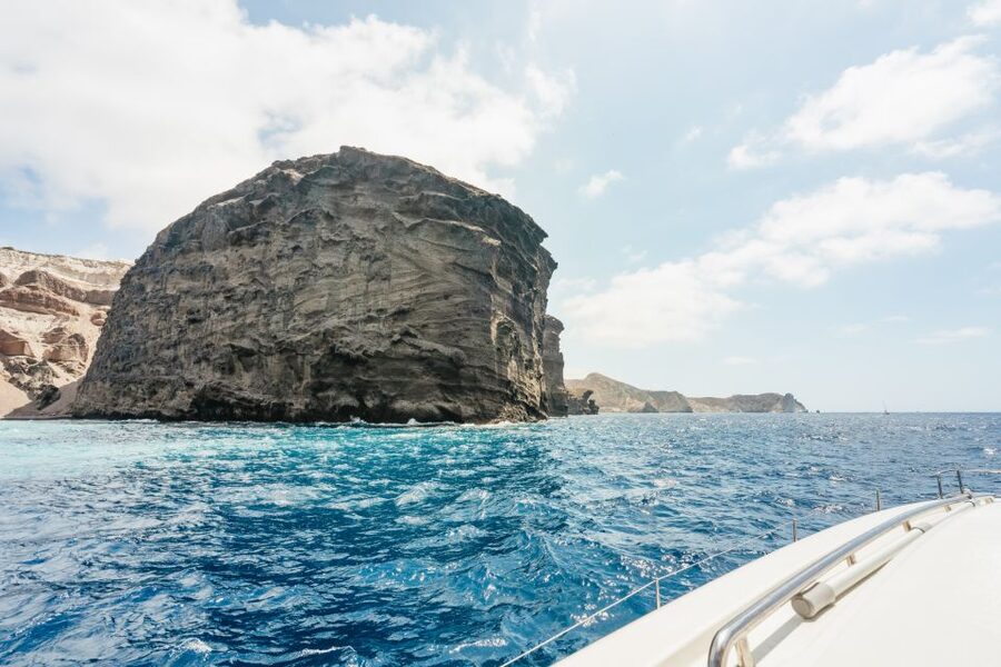 Santorini: Luxury Catamaran Day Trip with Meal and Open Bar - What the crew adds to the day