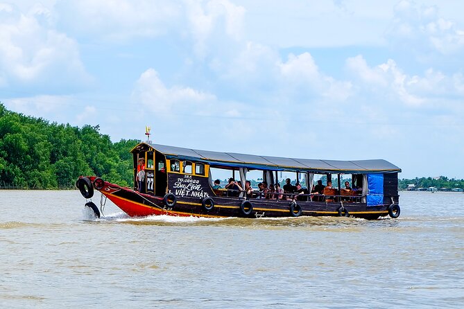 Small-Group Mekong Delta Day Trip: Boat Ride, Cottages & Pagoda - Traditional Music and the Human Side of the Tour