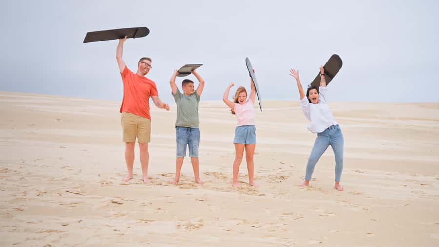 Sydney: Port Stephens Dolphin Cruise & Sandboarding Day Trip - Port Stephens dolphin cruise on turquoise water