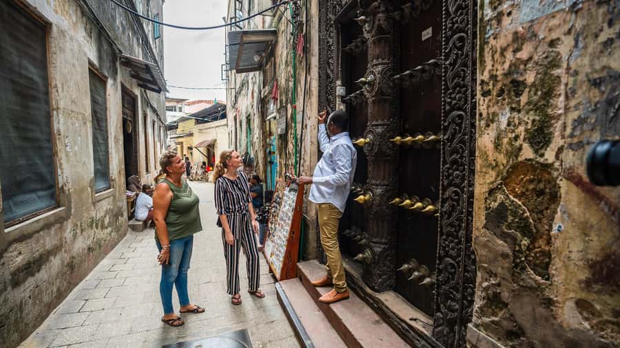 Zanzibar: Stone Town, Spice Tour, Prison Island with Lunch - Stone Town’s lanes, doors, and difficult past